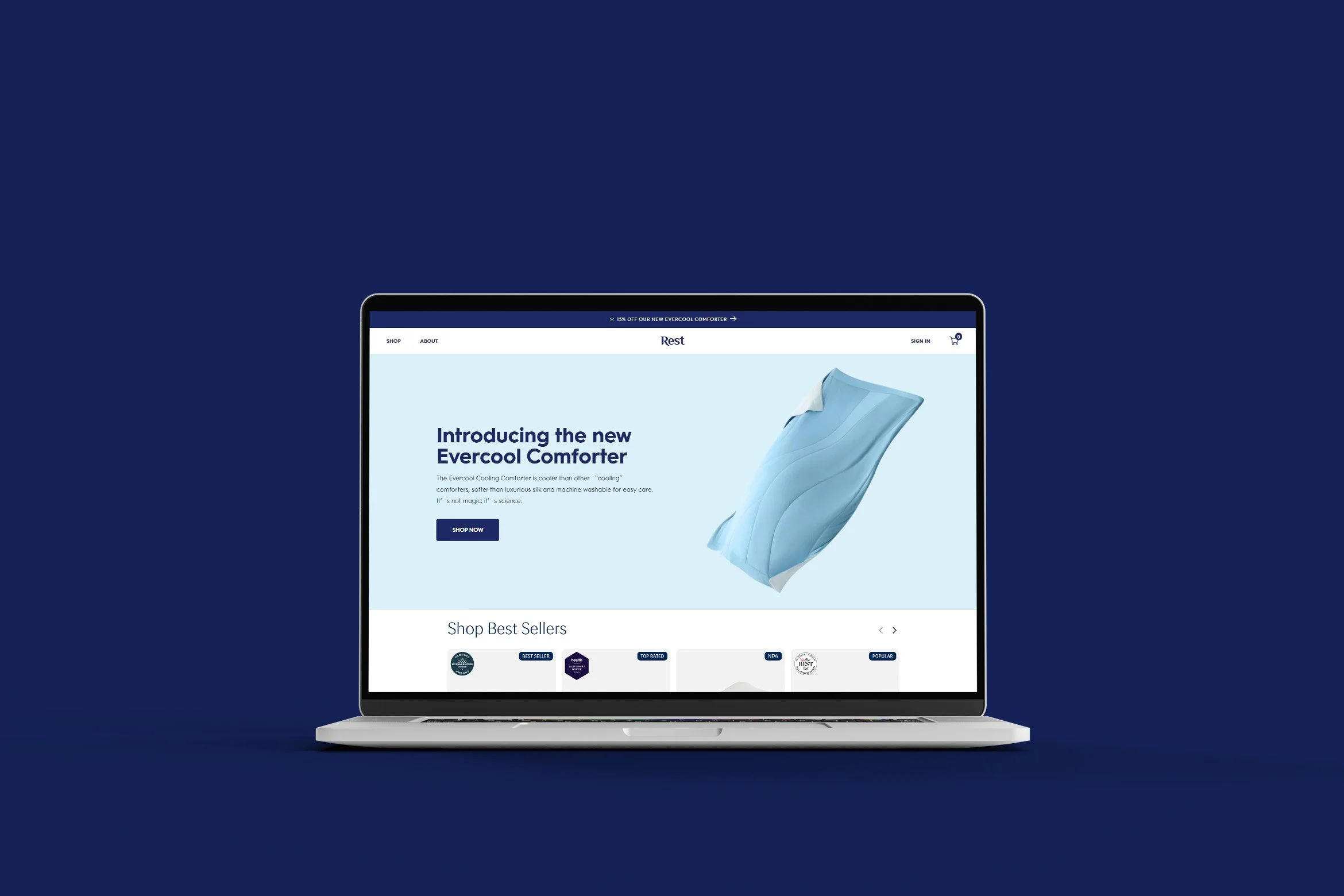 Laptop displaying a website for Evercool Comforter against a dark blue background.