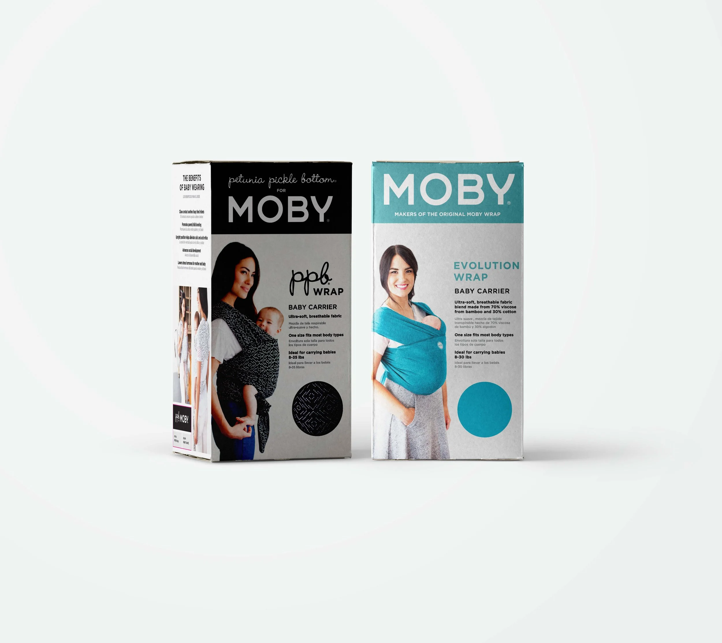 Two boxes of Moby baby carriers with models demonstrating how to wear them. The left box is for petite pickable bottom with a woman carrying a baby, and the right box is for the evolution wrap with a woman carrying a small child.