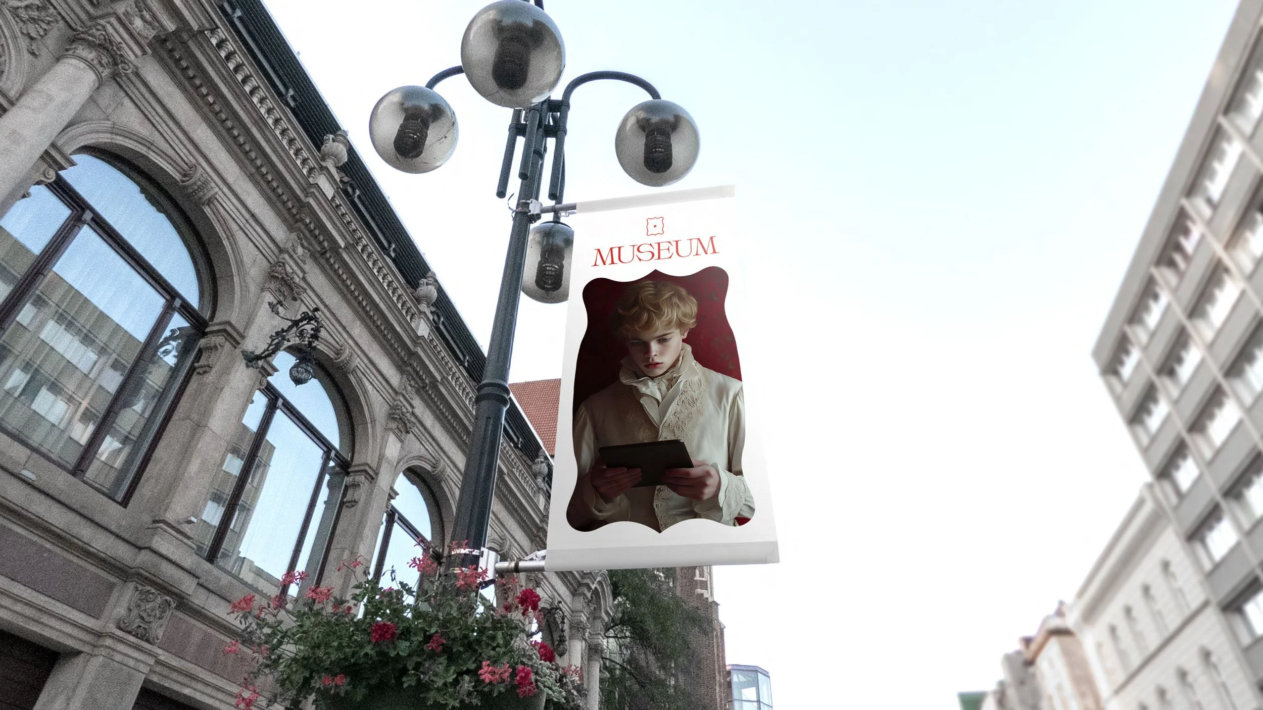 A street lamp with a sign hanging that has an image of a young boy with blond curly hair reading a book, and the word "MUSEUM" written on it. The street is lined with historic and modern buildings.