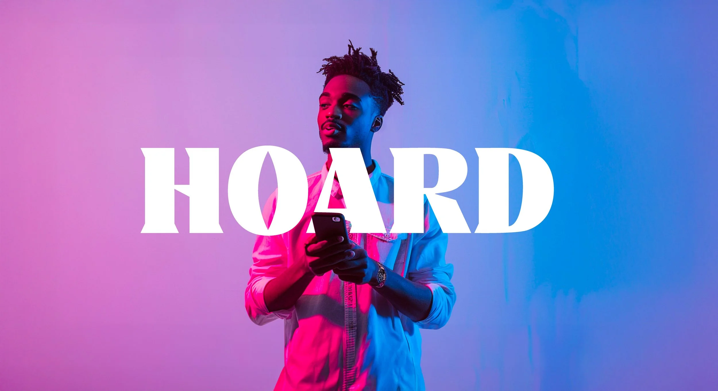 A young man with styled hair looking at his phone, with a pink and blue gradient background, overlaid with the word 'HOARD' in bold white letters.