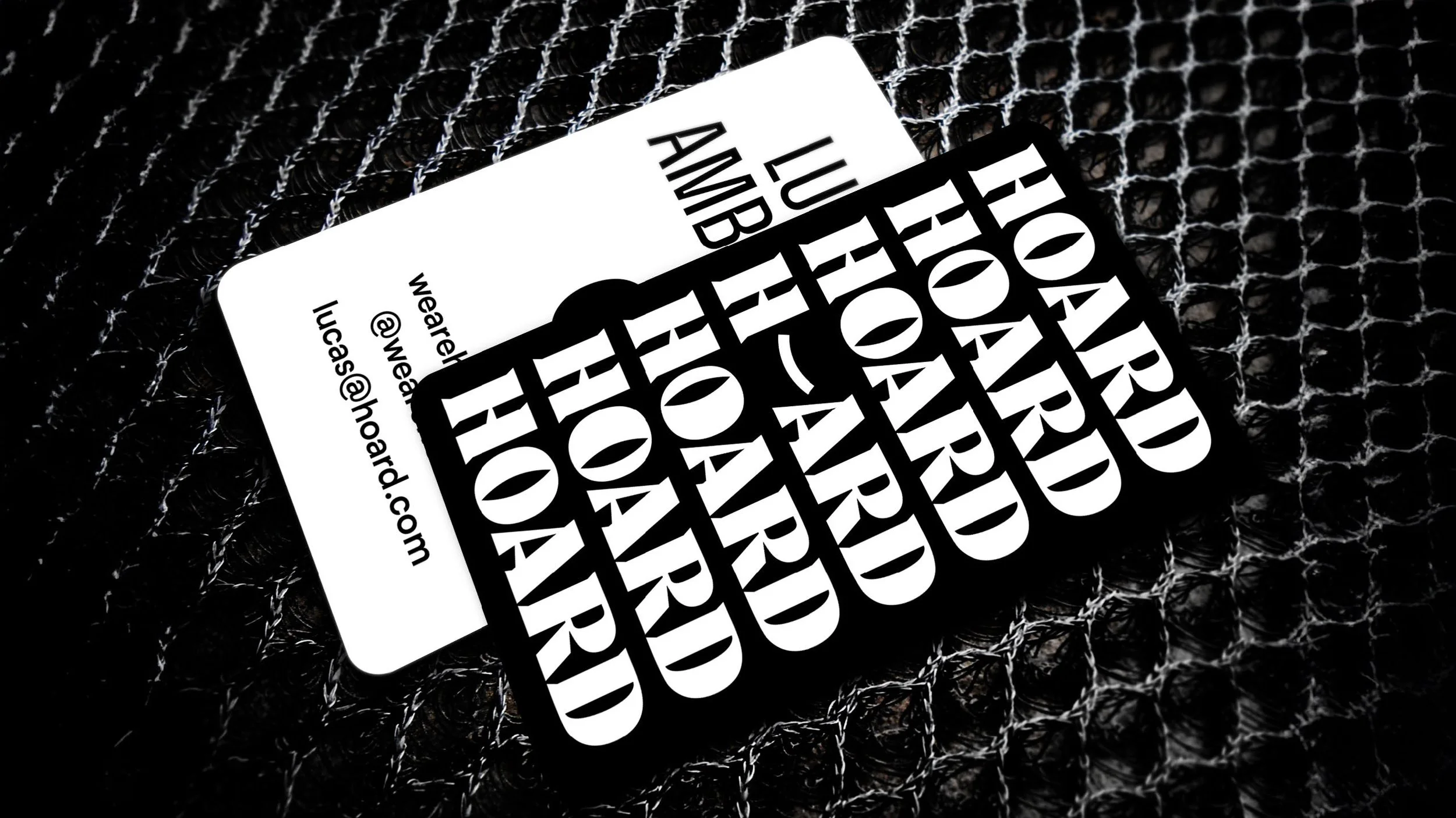 Bitcoin hair accessory promotion cards, black and white text on black background, with a textured black surface.