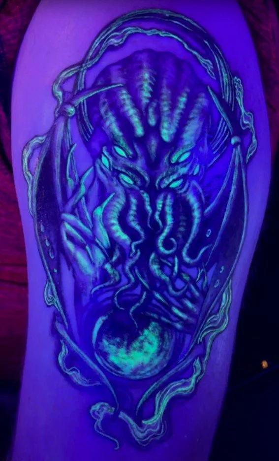UV reactive Cthulhu tattoo by Alicia Maye. Neon blue and purple under blacklight. Inklinations, Cashmere WA.
