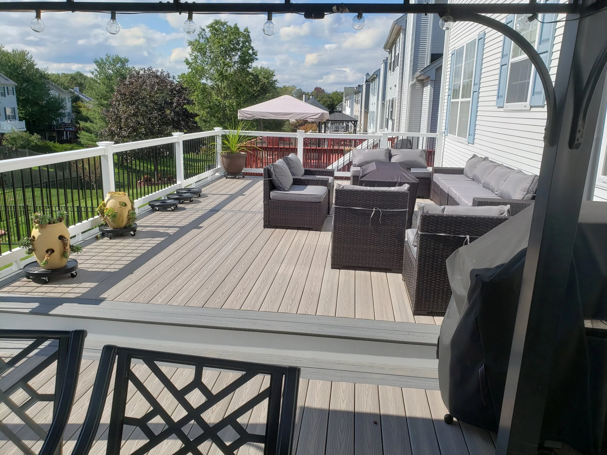 A spacious outdoor deck with enough space to have a gazebo to lounge with sun protection or the other side dedicated to enjoy the sun fully