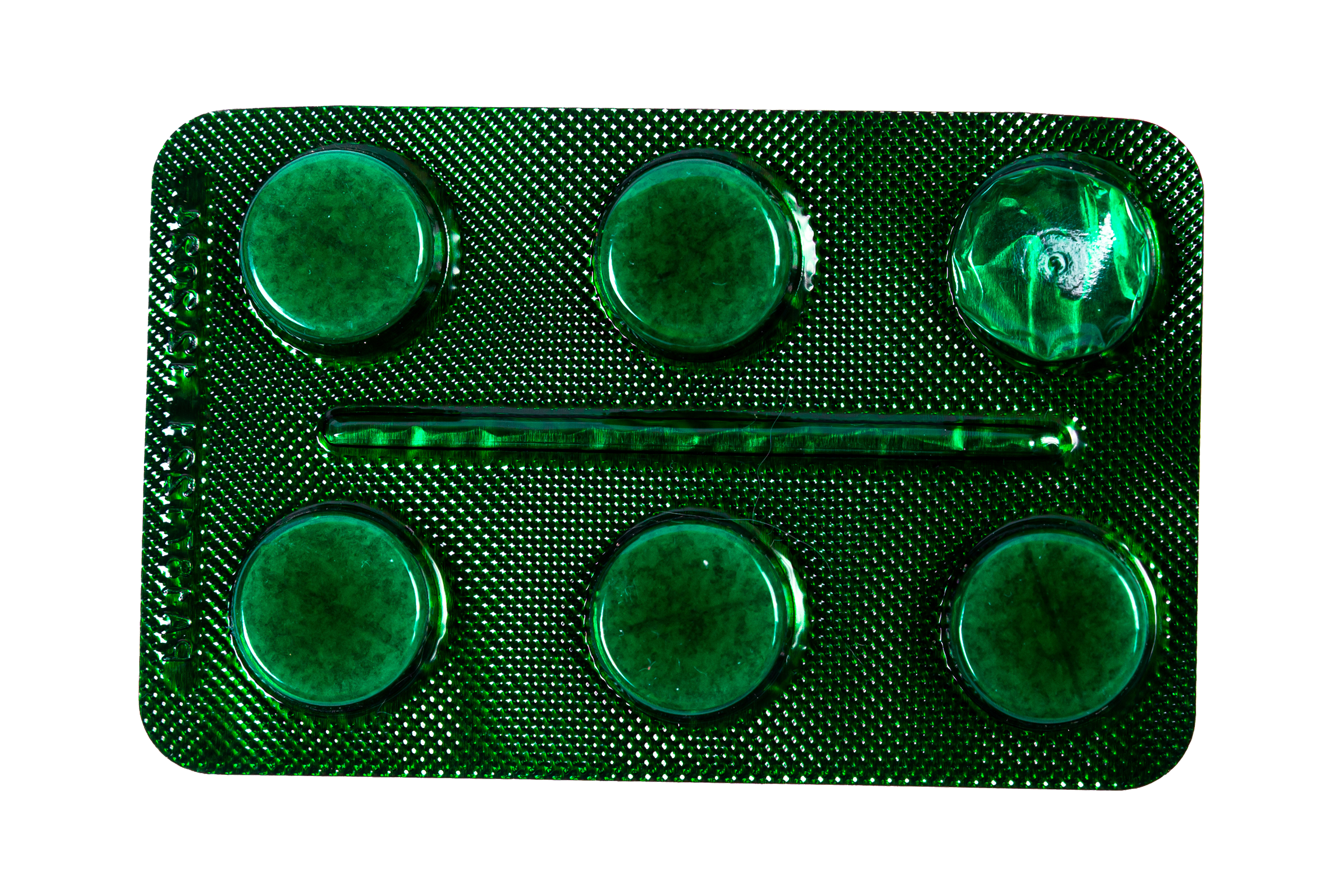 A close-up of a green blister pack of pills with four round pills visible.