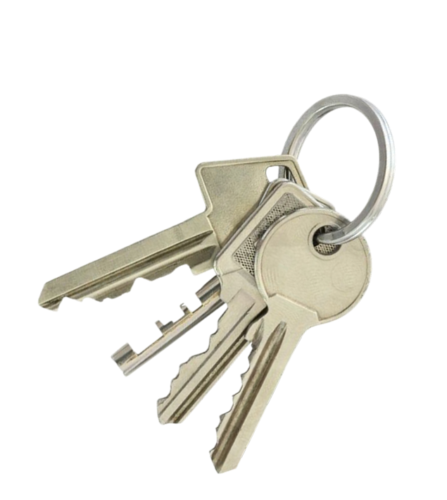 A set of silver keys on a keyring isolated on a black background.