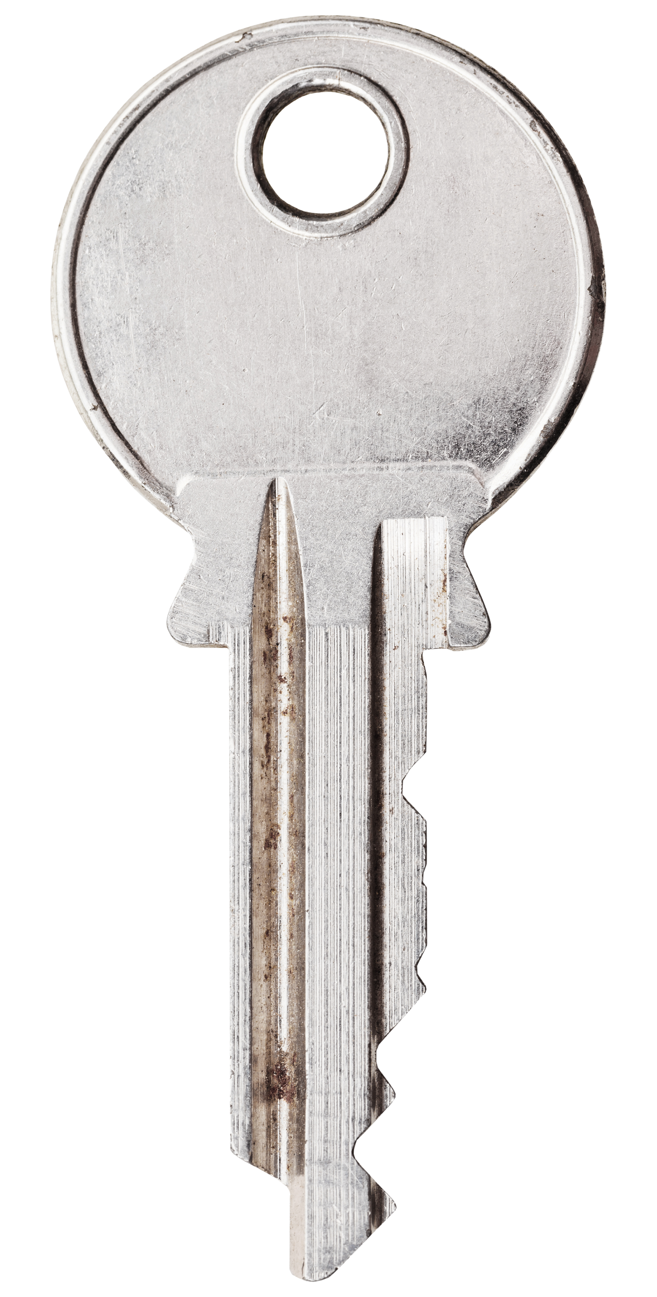 A close-up of a metal key with a circular head and a long, serrated blade.