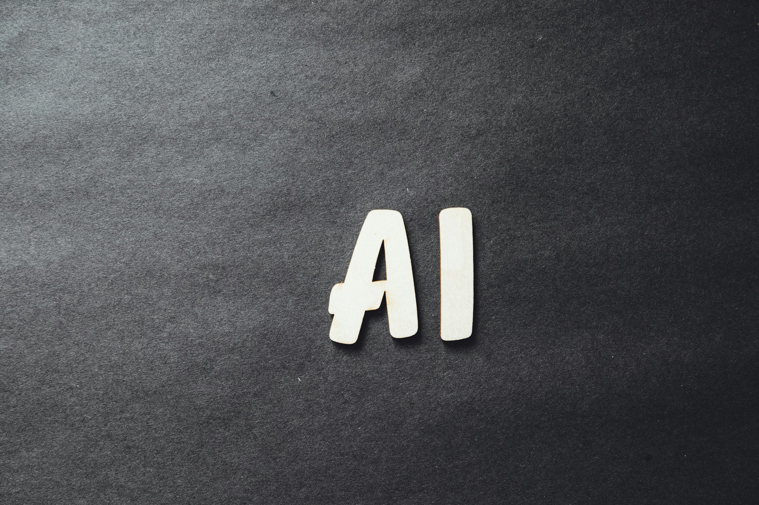 white letters "AI" on a black background standing for AI Overviews