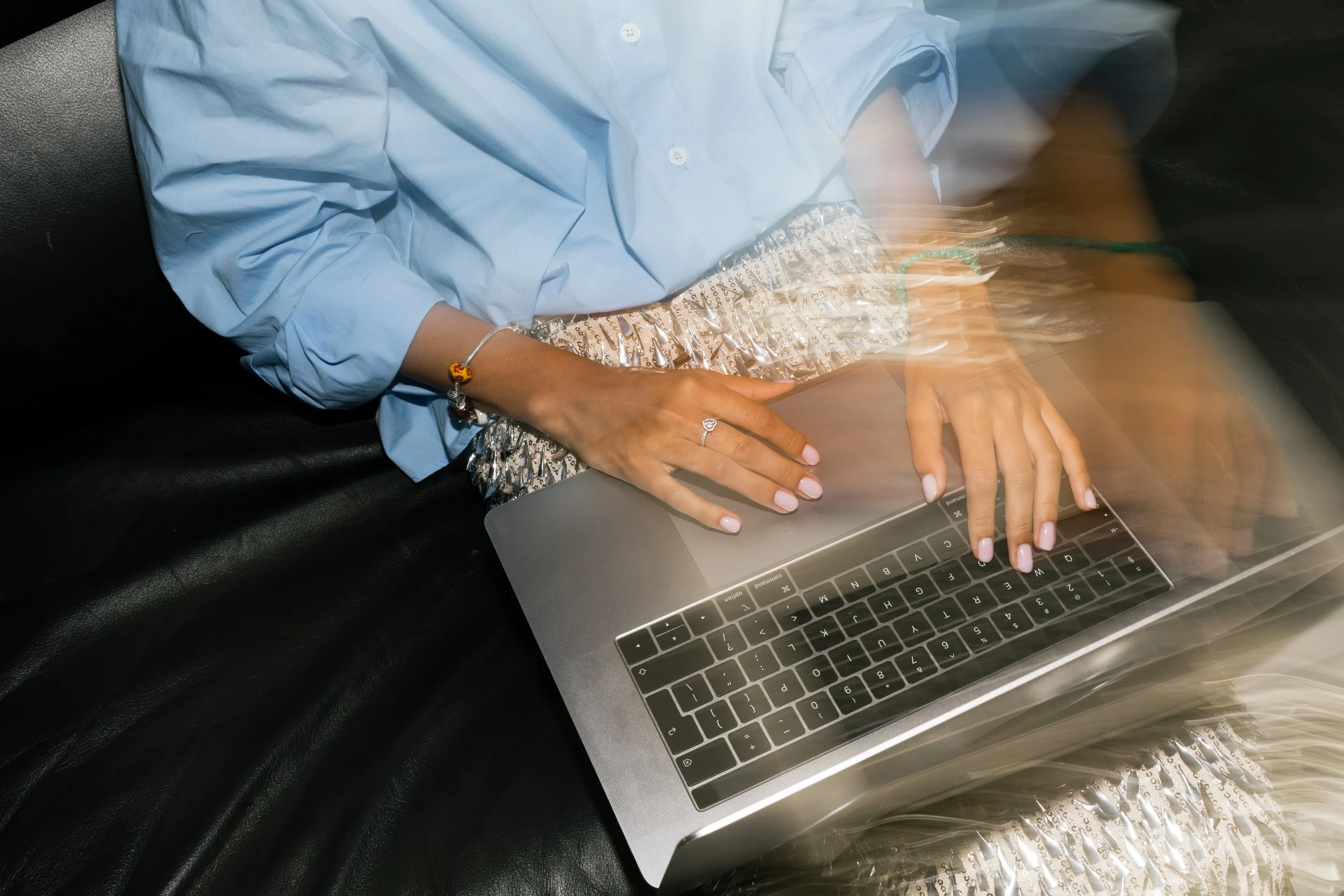 A professional working on a laptop.
