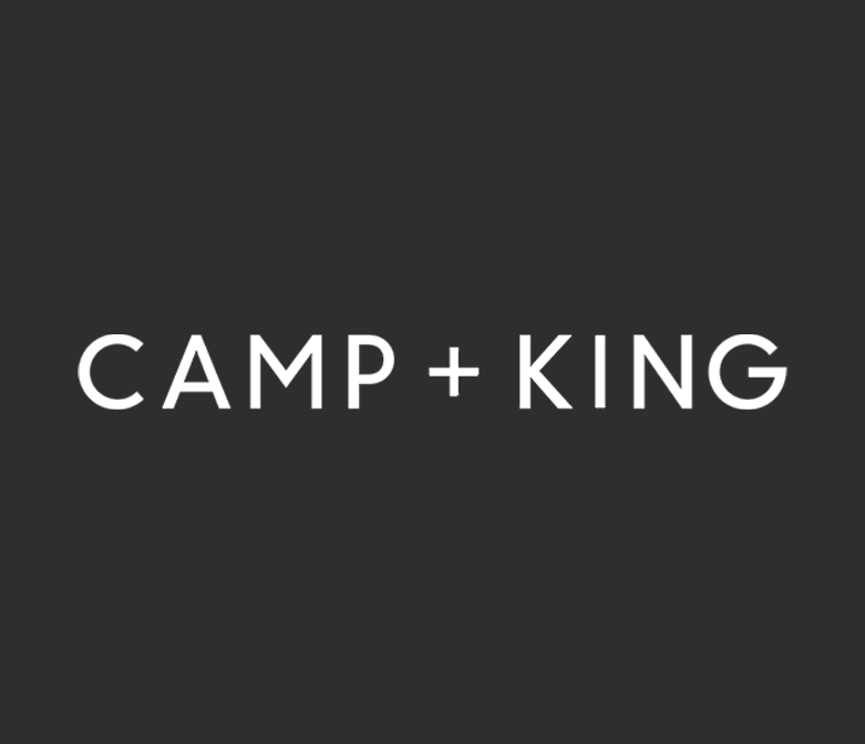 Black background with white text that reads "CAMP + KING"