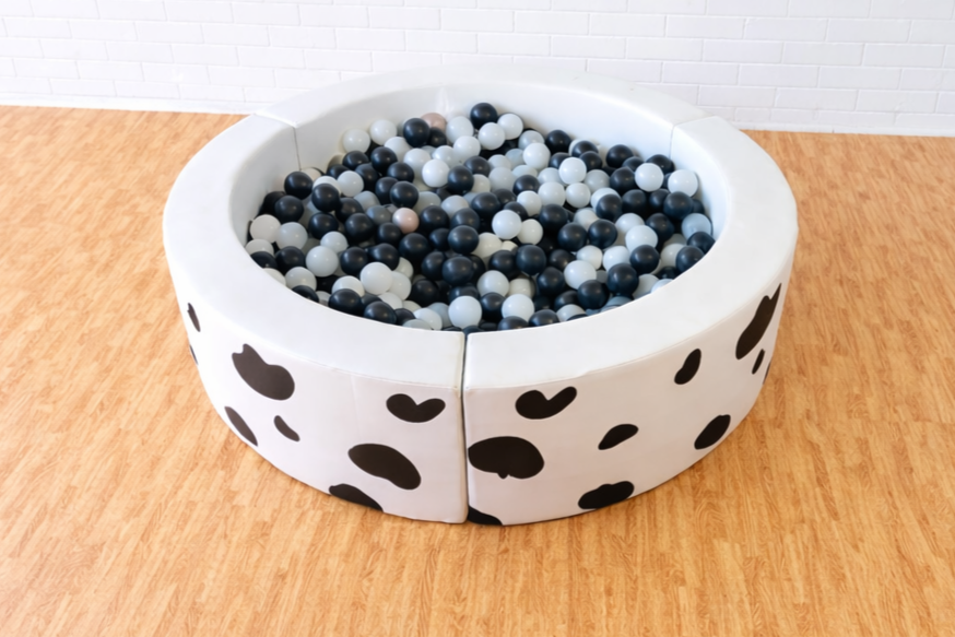 Round ball pit with cow print Barnyard animal farm Theme Toddler soft play ball pit hire Perth