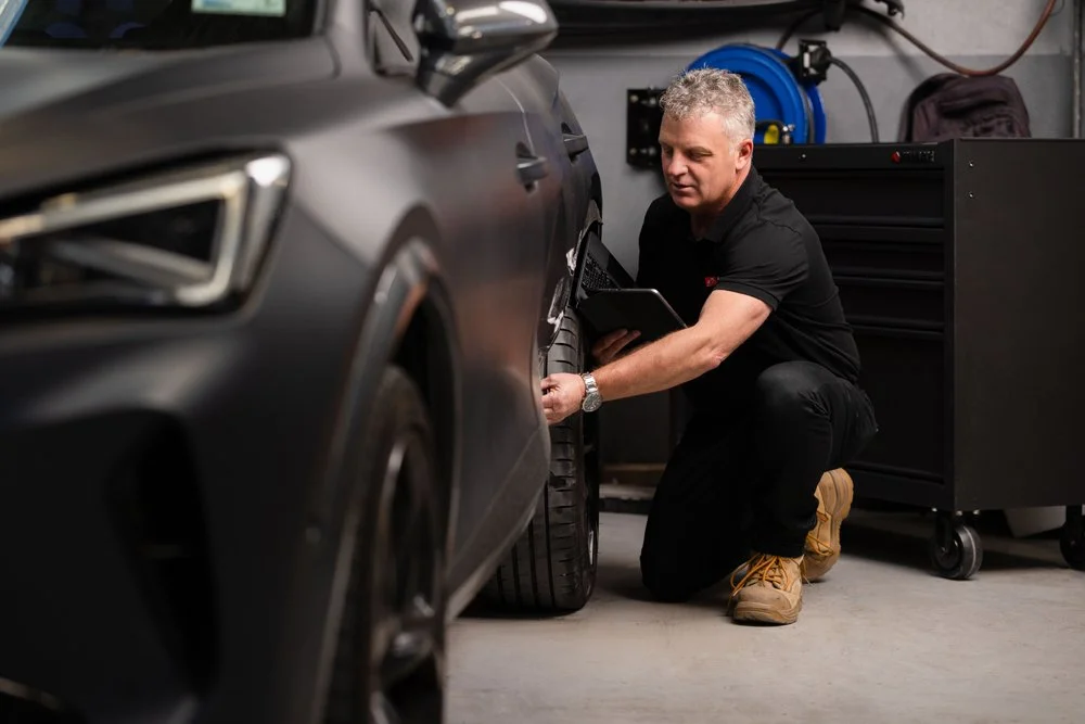 Andy Trumper inspecting an auction damaged vehicle