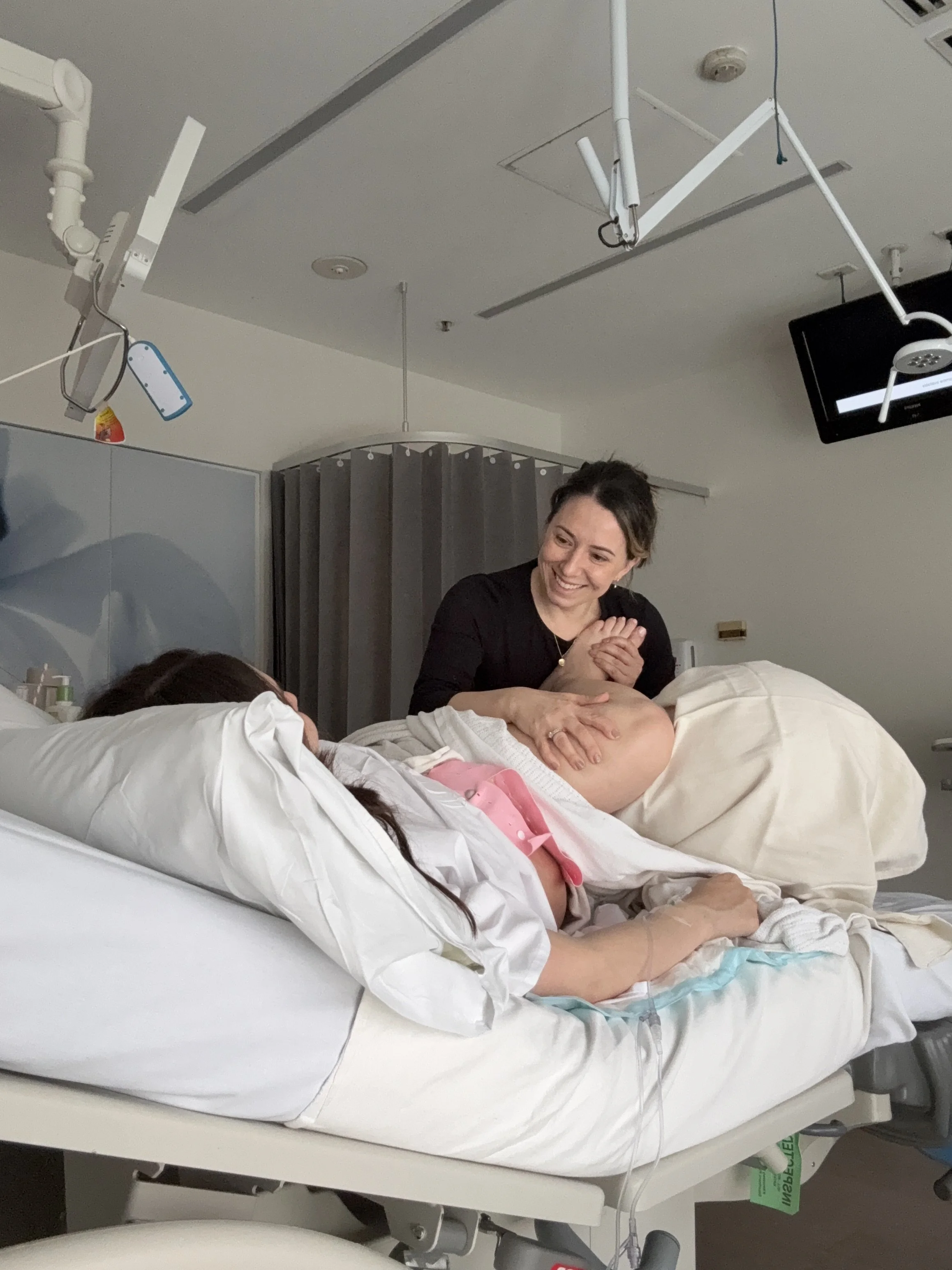 Steph the Doula providing hands-on support during labour at a metro Melbourne hospital.
