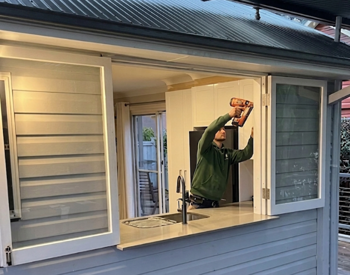 New Leaf Carpentry installation of timber casement, servery style window with retractable screen.