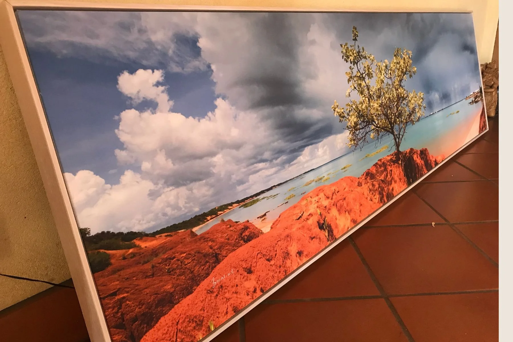 Panoramic coastal landscape photograph in a slim white float frame