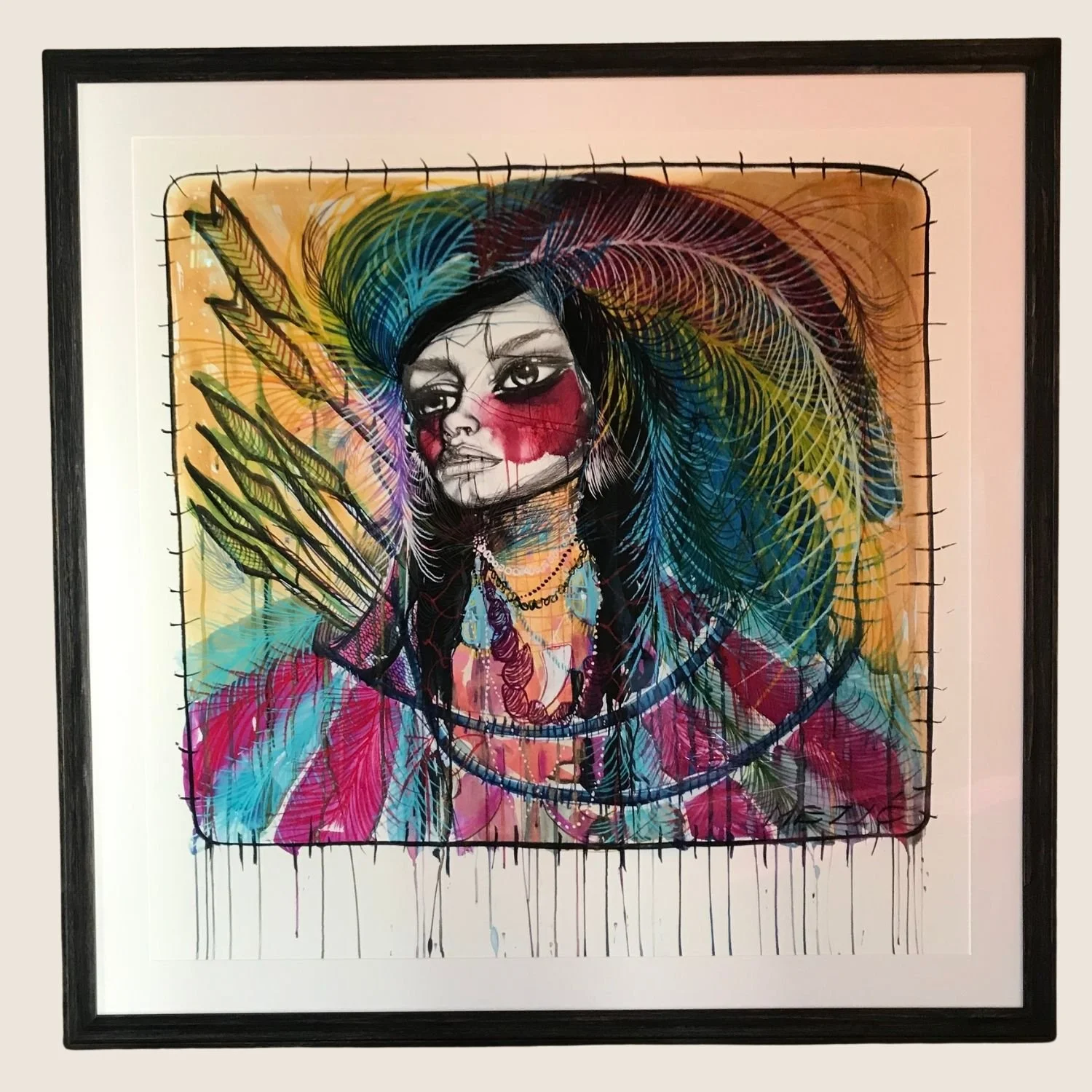 Contemporary feather portrait in a black frame with white mat