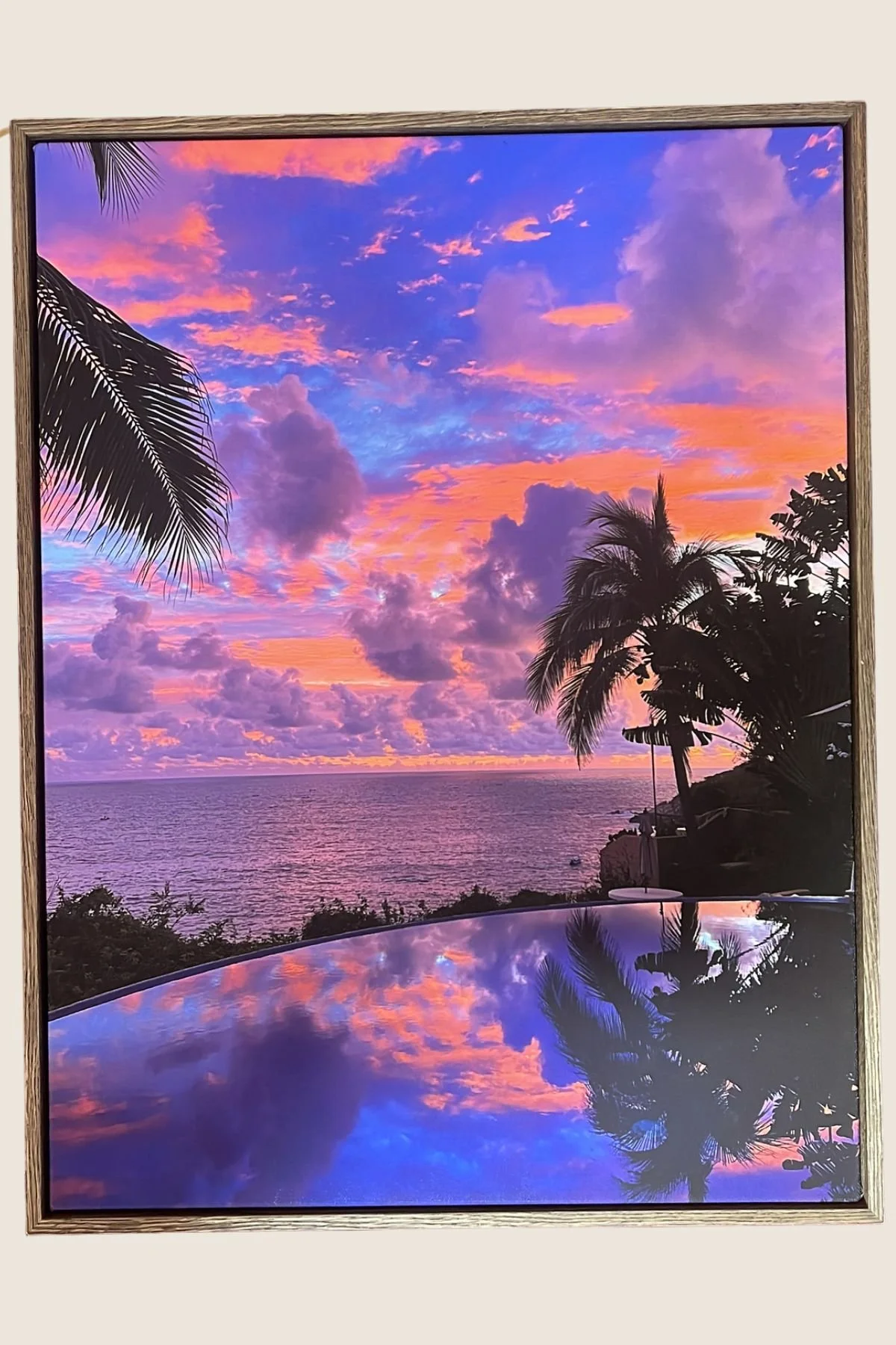 Tropical sunset photograph in a dark oak float frame