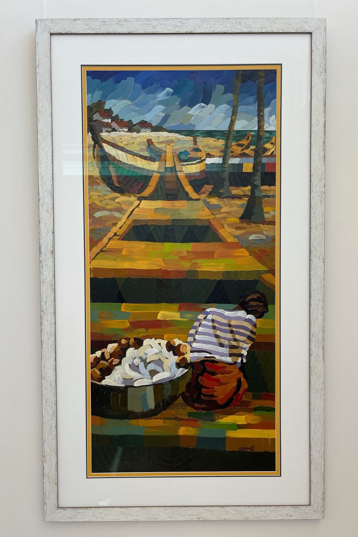 Fishing village oil painting in a distressed silver frame, double mat