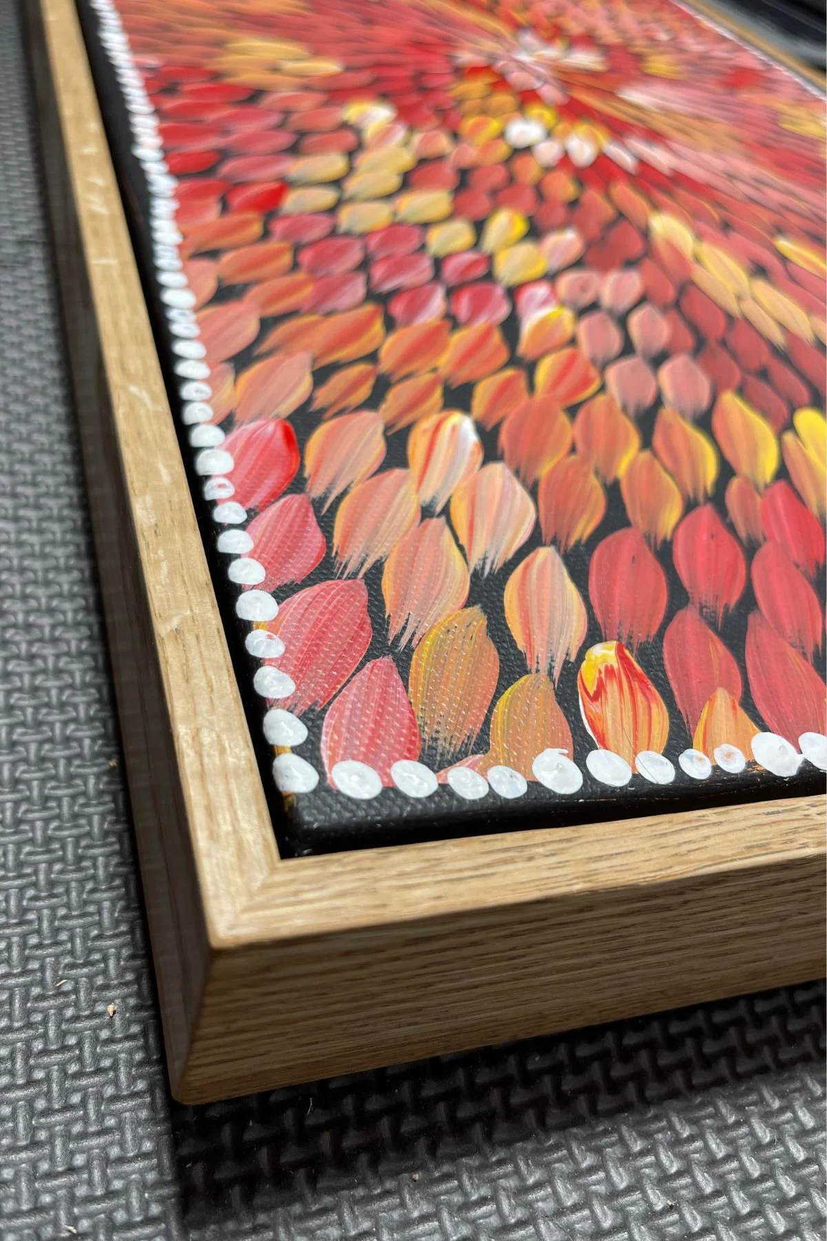 Float frame detail — Aboriginal leaf motif painting, oak