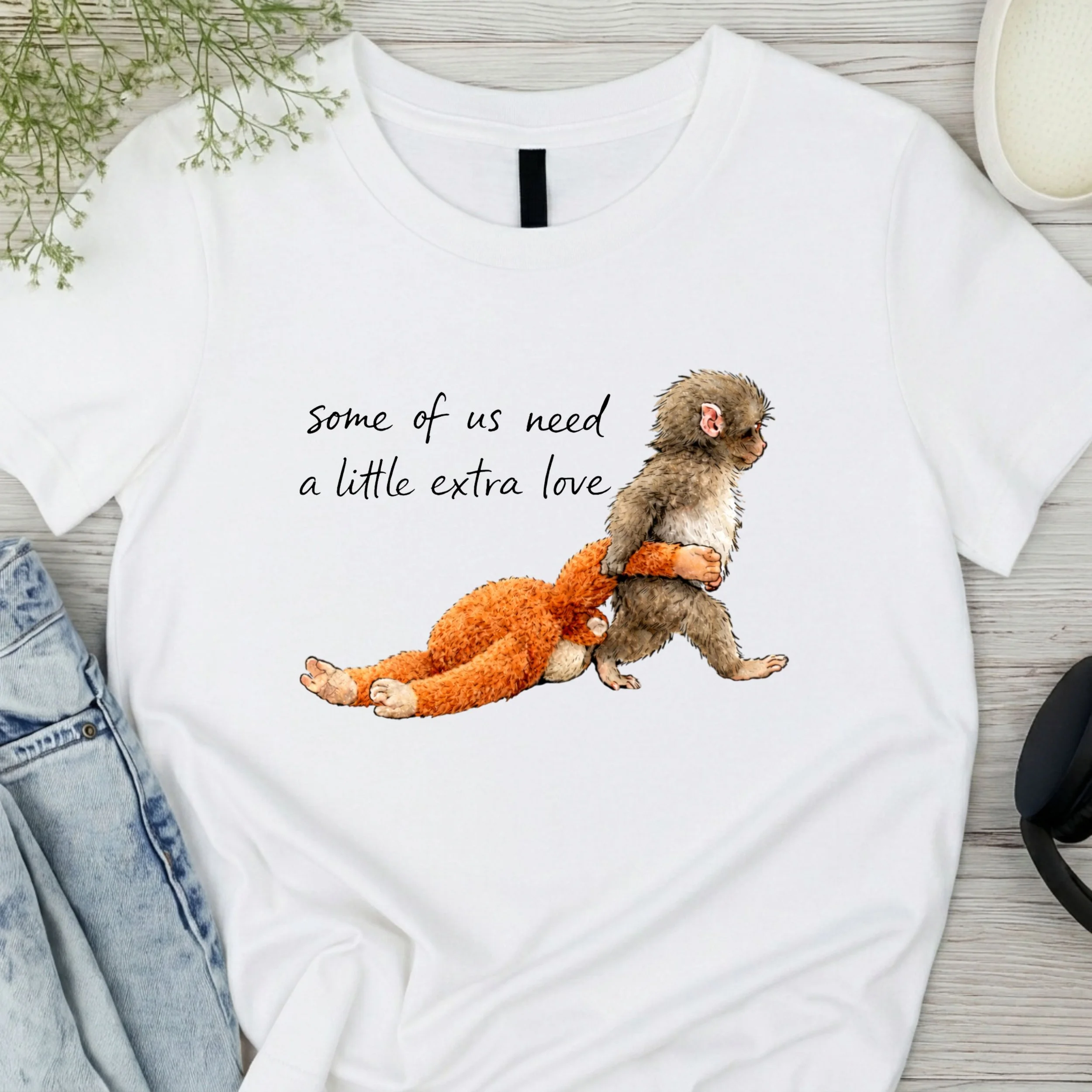 "Some Of Us Need A Little Extra Love" Graphic T-Shirt - Heartwarming Monkey Illustration Tee - Meaningful Casual Apparel