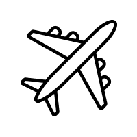 A silhouette of a person skydiving against a cloudy sky during sunset.