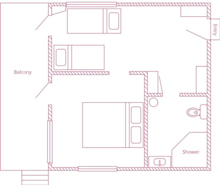 Floor plan of a small apartment with a bedroom, a balcony, a bathroom with a shower, and an entryway.