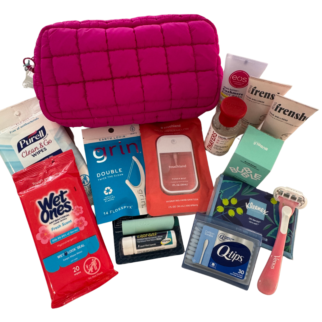 Travel toiletries and hygiene products including wipes, toothpaste, floss, hand sanitizer, body wash, moisturizer, wipes, and a pink quilted toiletry bag for the Bachelorette Party.