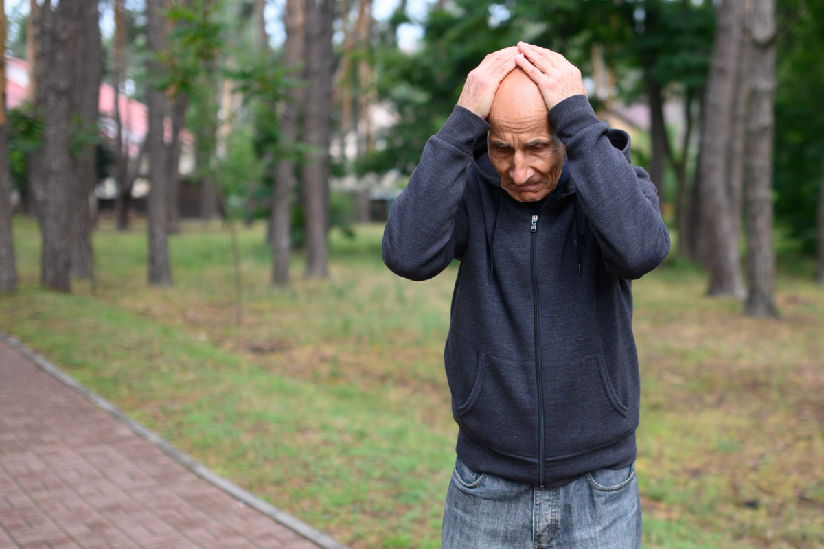man stressed in a park