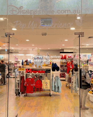 Entrance to a Disney store with display of children's clothing and toys
