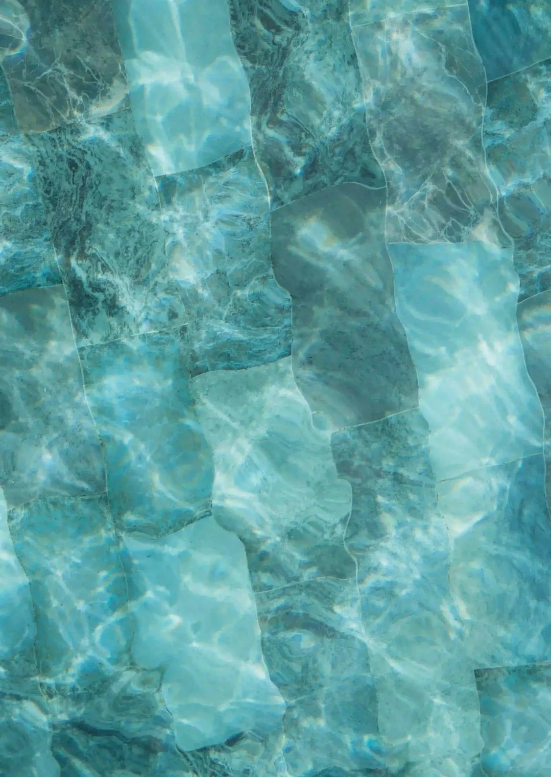 Closeup Picture of a pool with different colour blue tiles