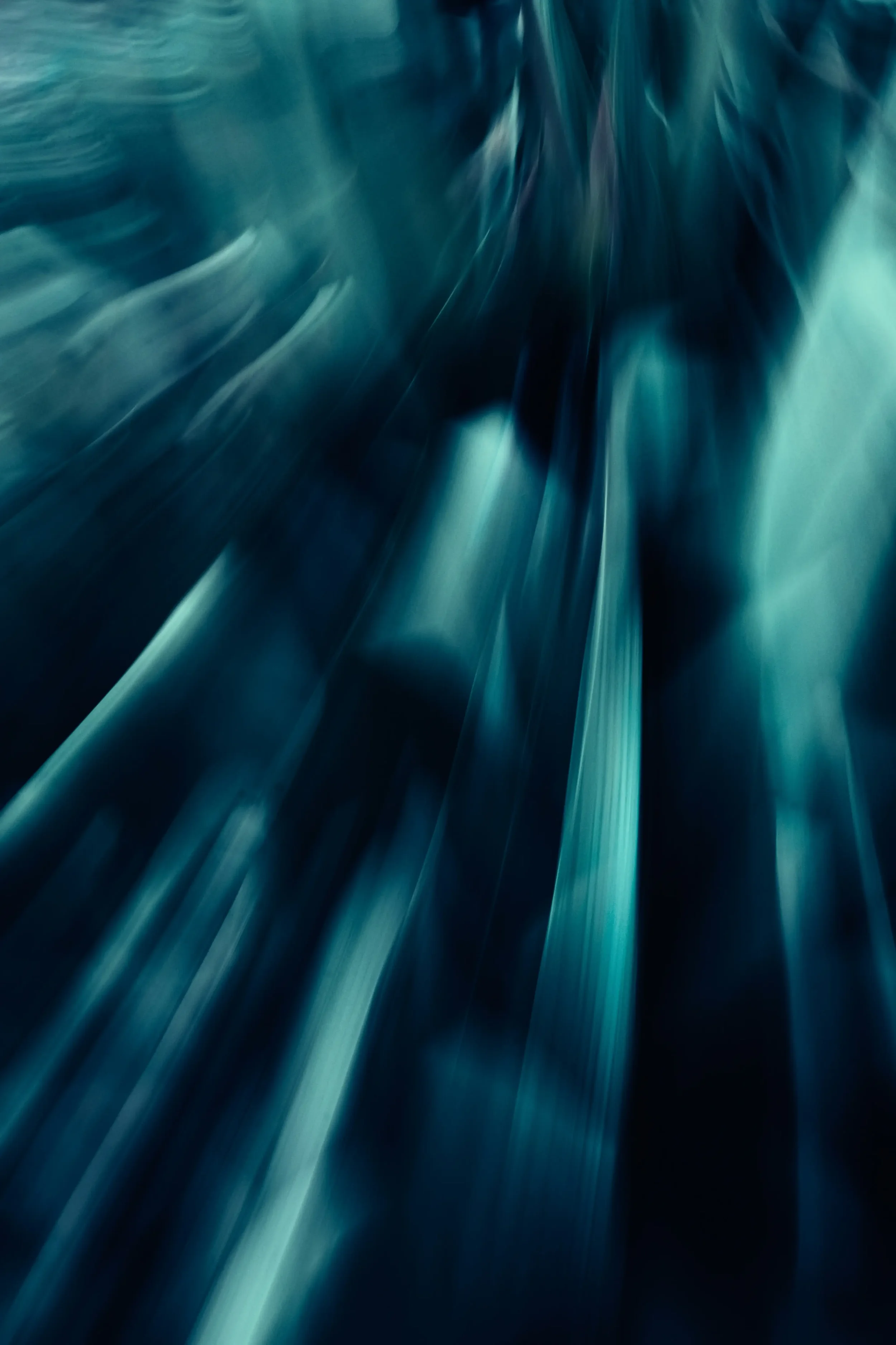 Blue-turquoise graphic used as a background