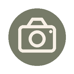 Placeholder image of a camera icon on a green circle background.