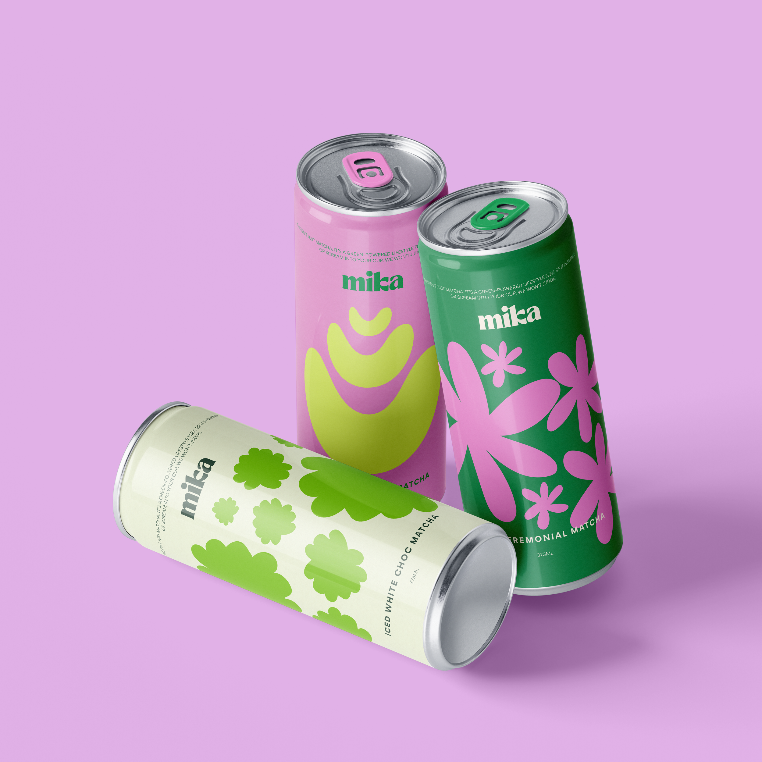 Three cans of Mika flavored sparkling water in pastel pink, white, and green containers on a purple background.