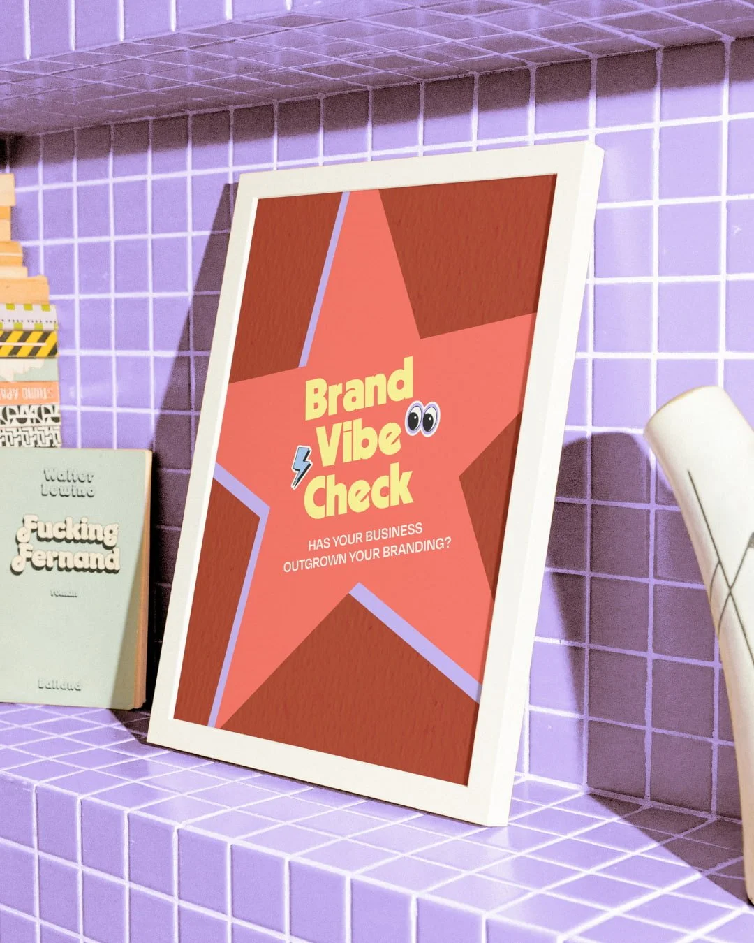 A colorful sign that says 'Brand Vibe Check' with a question about outgrowing branding, featuring a star with eyes in the background. The sign is placed on a purple tiled shelf.