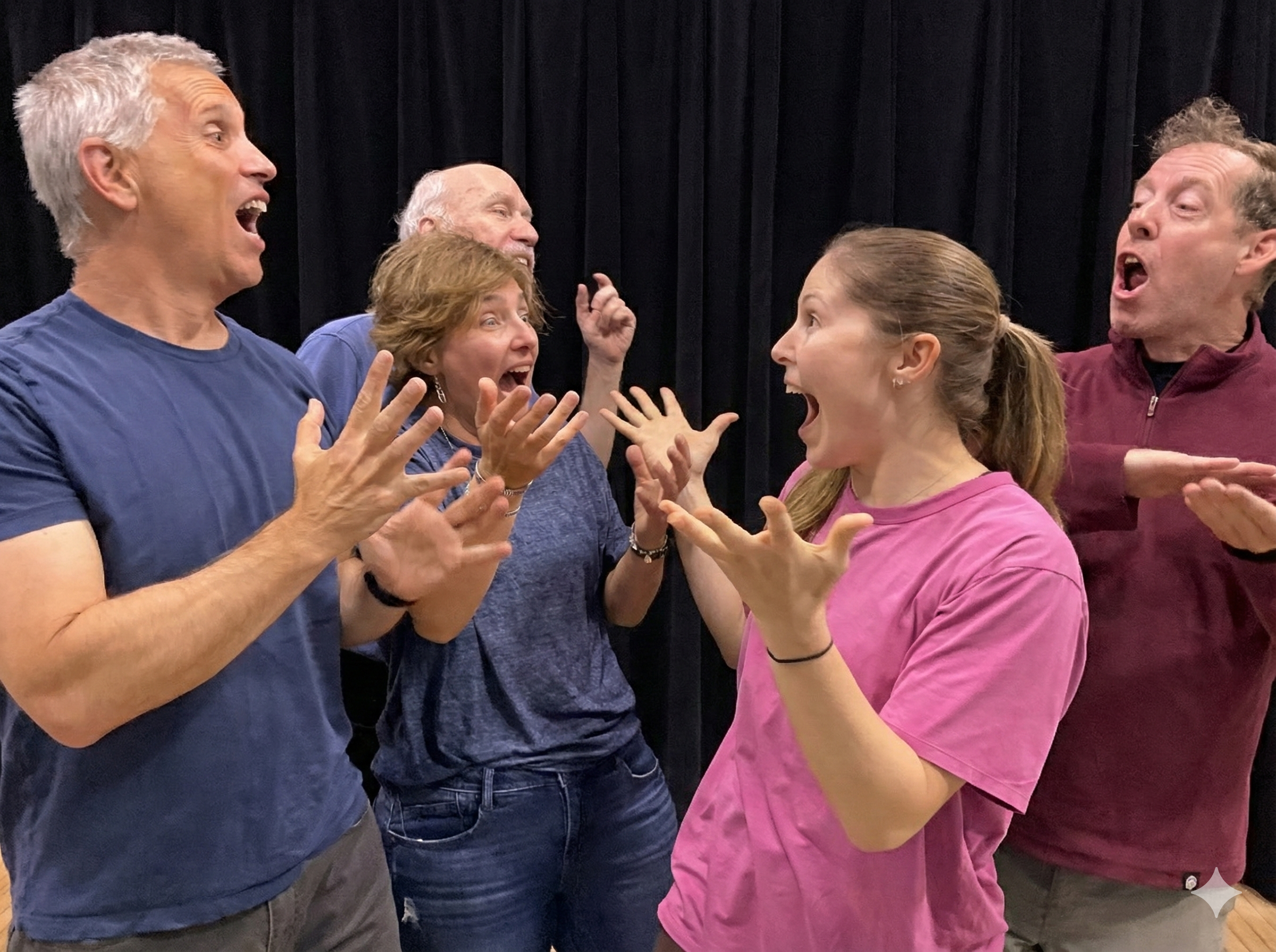 Bethesda Improv Theater actors playing an improv scene in front of a black stage curtain.