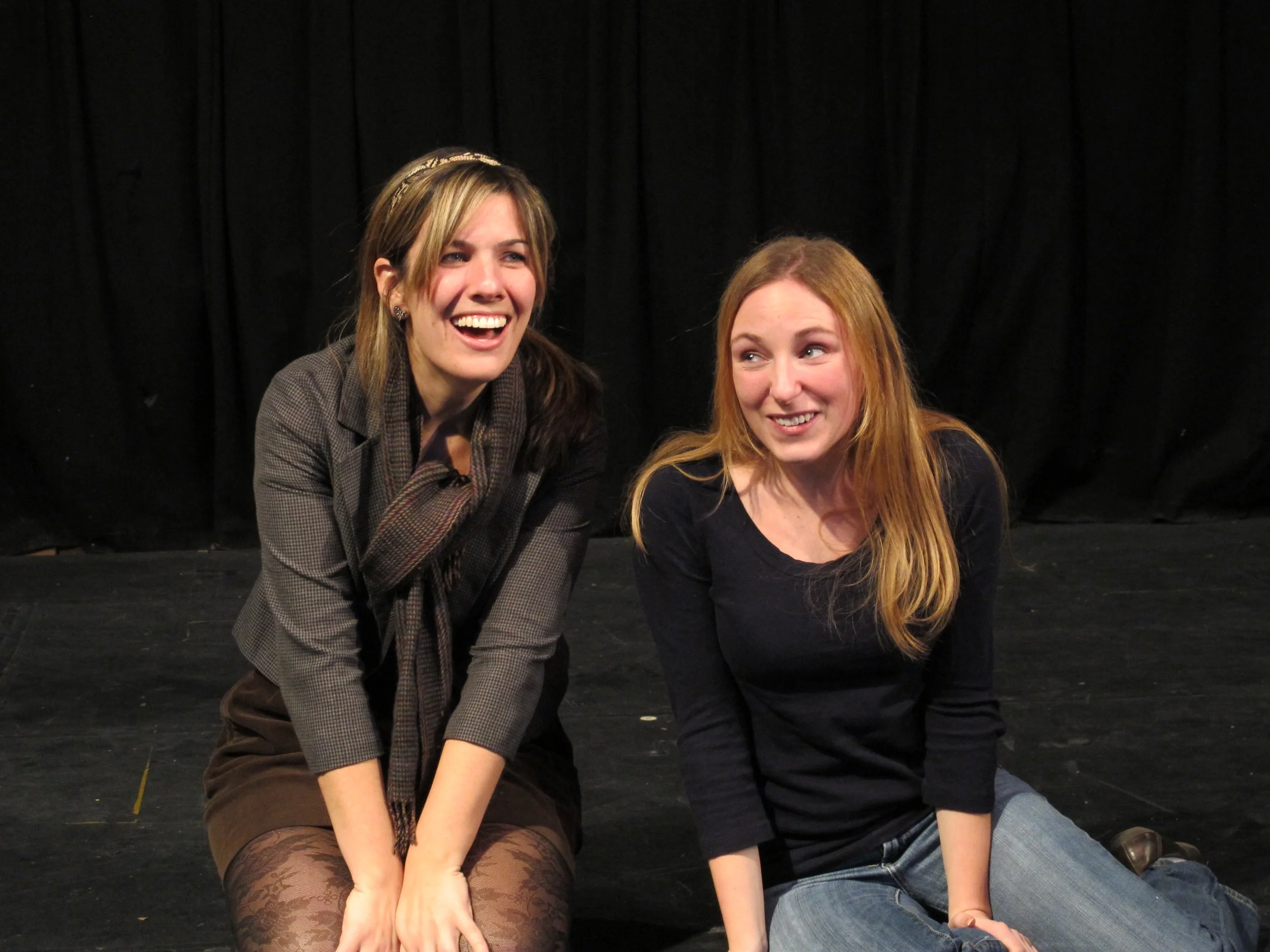 Two improv students listening and reacting in a scene at a Precipice Improv Theater class in Bethesda, MD.