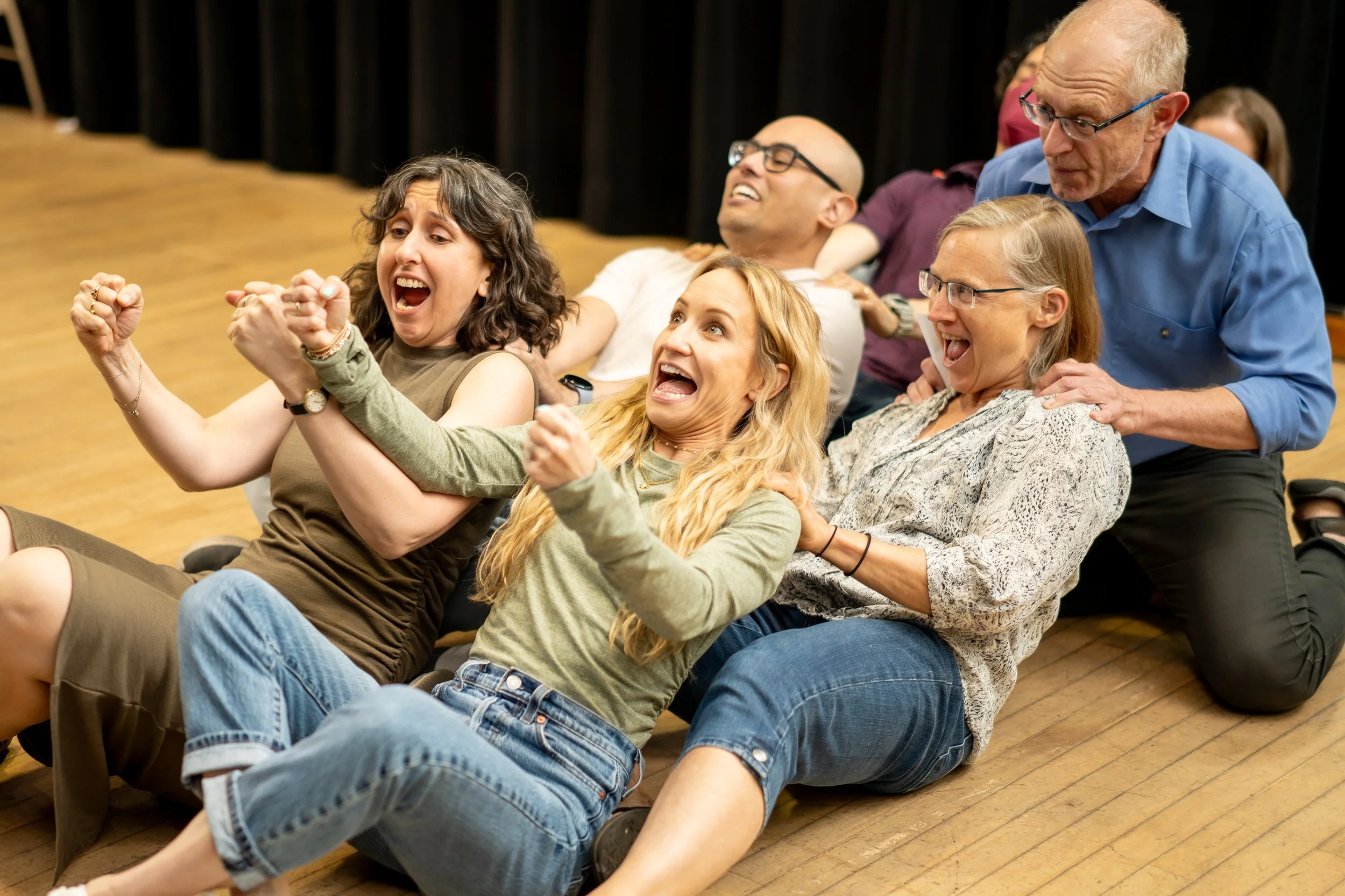 Students laughing during an improv class at Bethesda Improv Theater in Bethesda, MD.