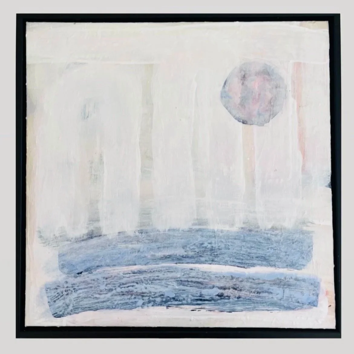 Abstract painting with a circular shape and horizontal brushstrokes in blue and pastel tones, framed in black.