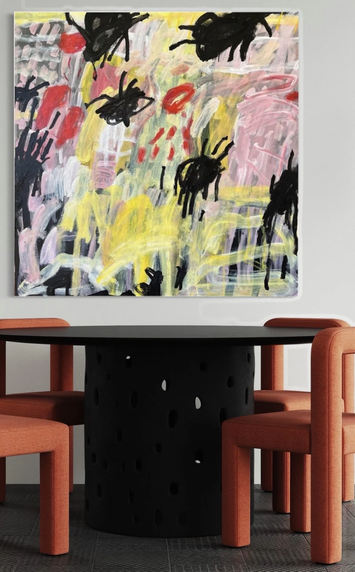 A wall with abstract colorful painting featuring black spider-like figures, pink, yellow, red, and green strokes, and scattered red dots, with a black table and orange chairs around it.