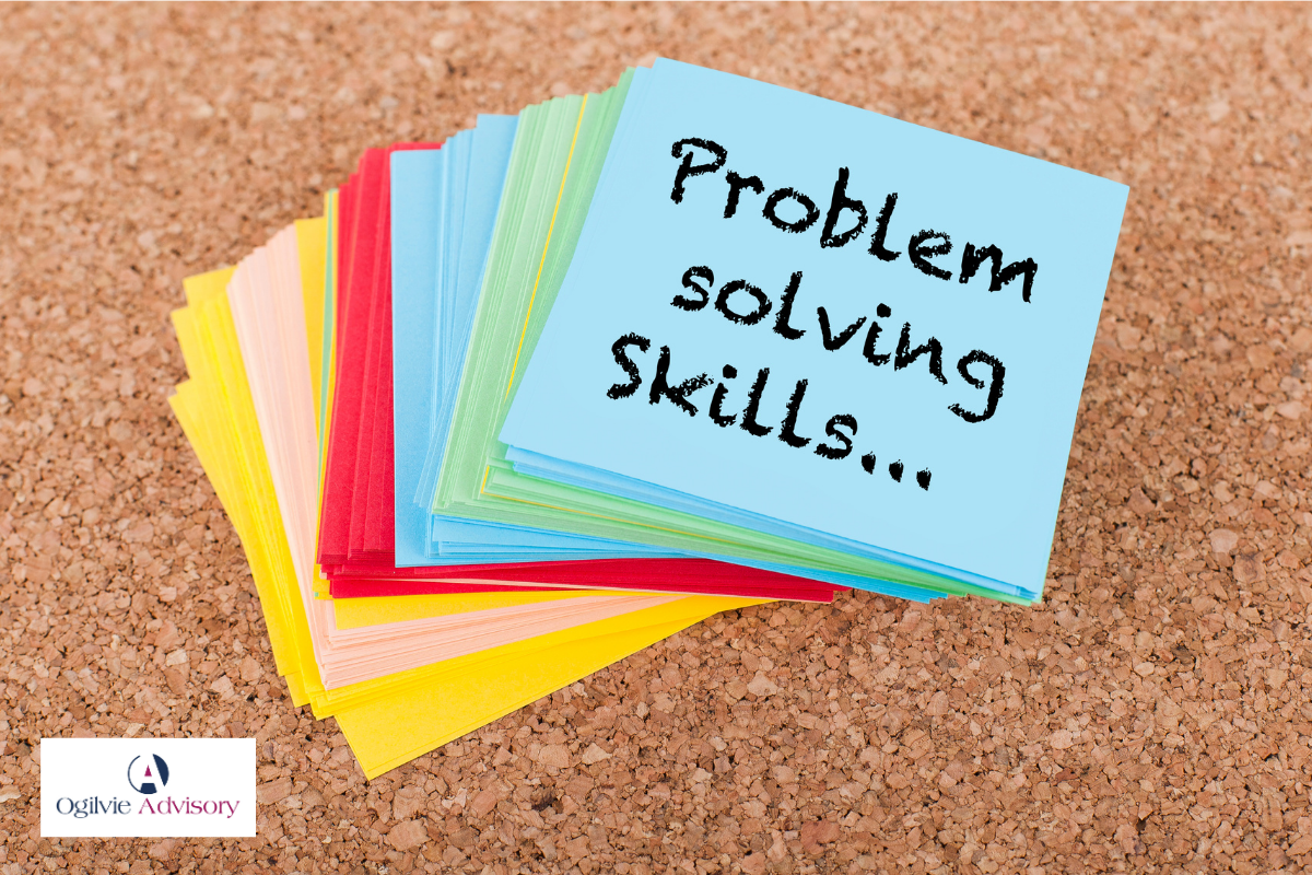 Business is problem solving skills a cork board with sticky notes on it at Ogilvie Advisory