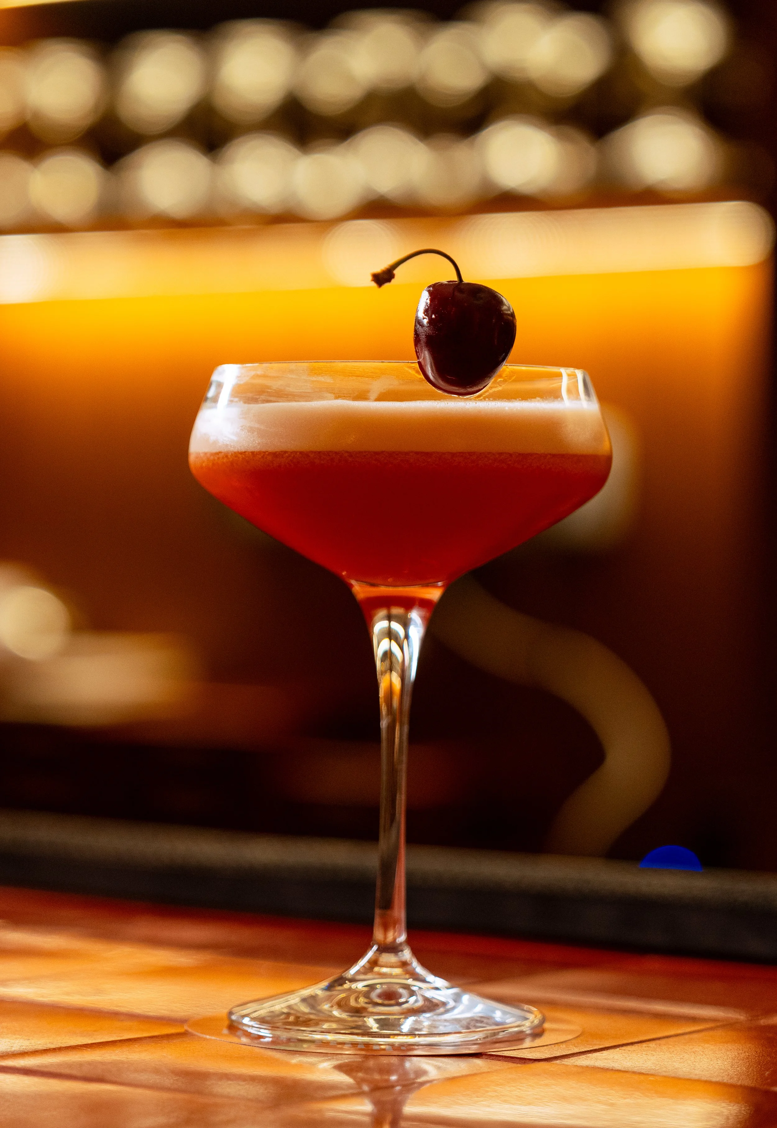 A martini cocktail with olives