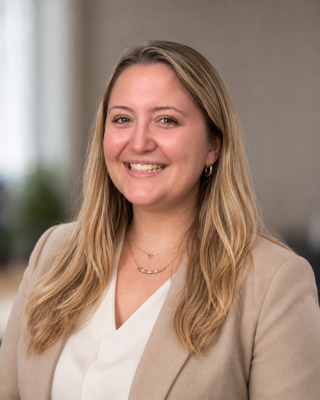 Registered Dietitian and media nutrition expert Laney Miller smiling in a beige blazer.