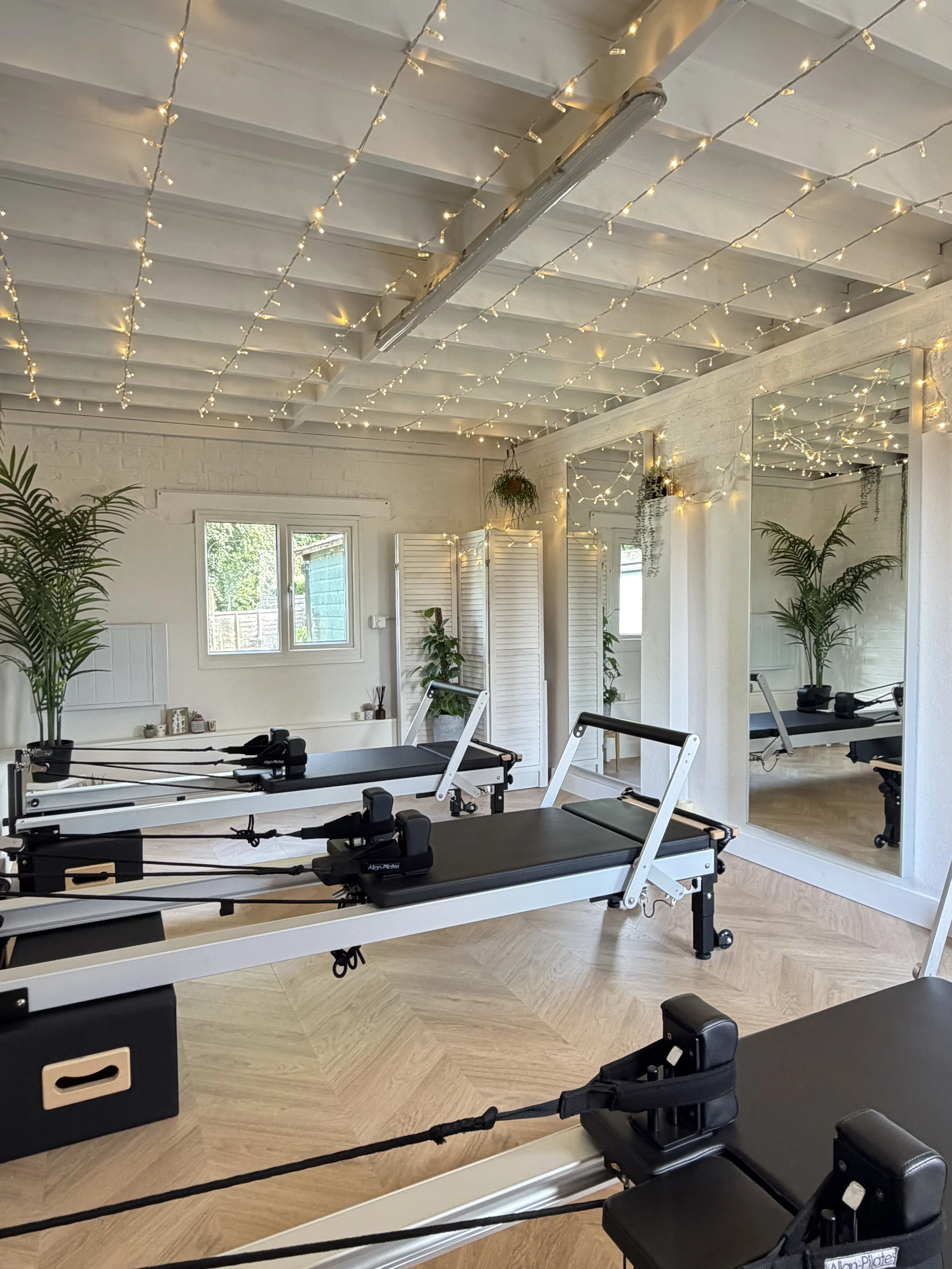 Welcome to the inside of Flow & Glow Pilates reformer studio in North Gorley near Ringwood, Hampshire. A fun and friendly reformer studio with a calm, minimal, and welcoming environment designed for focused movement and small group classes.