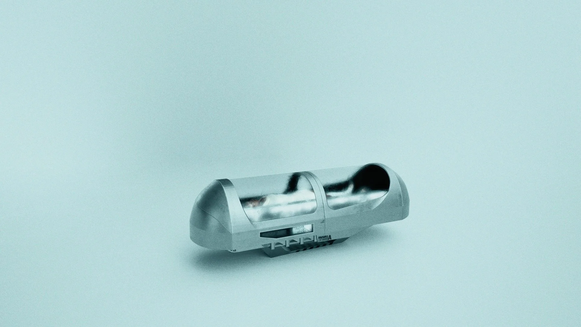 A metallic automated pill dispenser with two transparent compartments and digital display, placed on a light blue background.