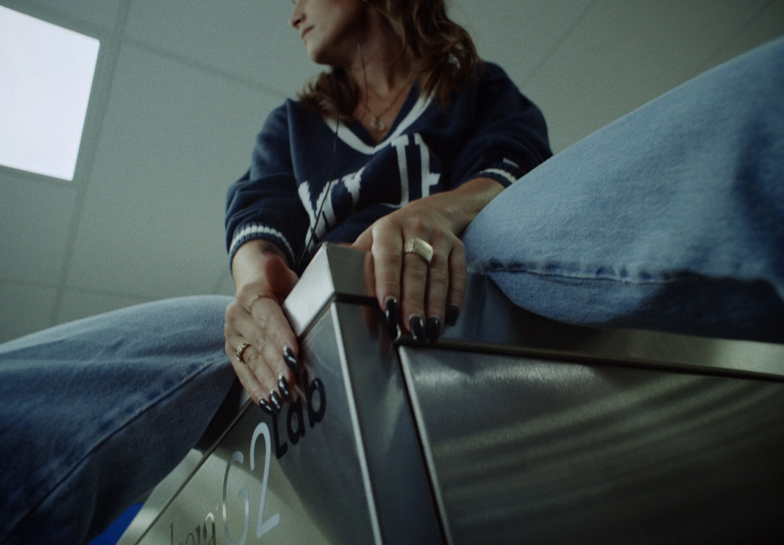 A woman placing a ballot into a ballot box at a polling station.