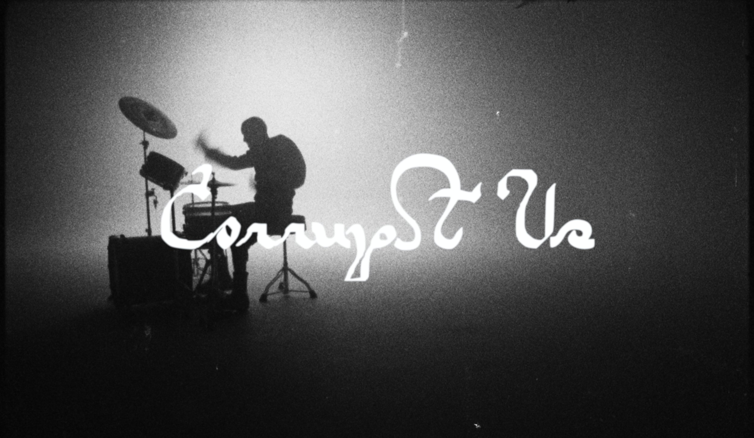 Black and white image of a person playing drums with a cymbal, situated on a stage or in a studio, with the text "Concerts?" written across the scene.