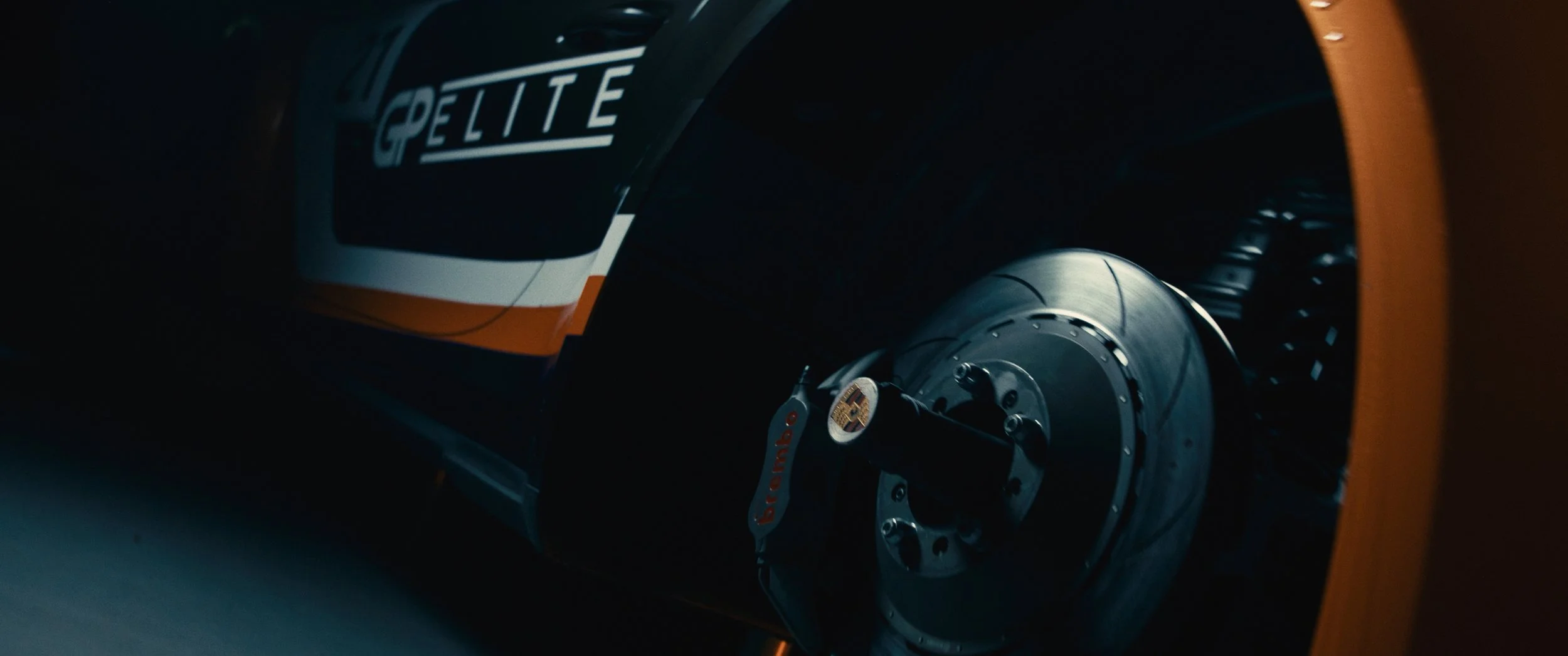 Close-up of a race car's wheel and brake assembly, with the 