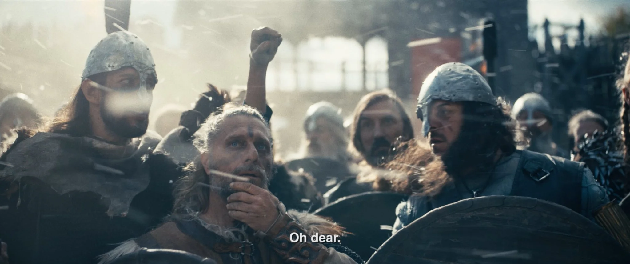 A scene from a movie showing Vikings on a boat, with some wearing helmets. One man is holding his chin, and another with long hair and a beard looks worried. The caption reads "Oh dear."
