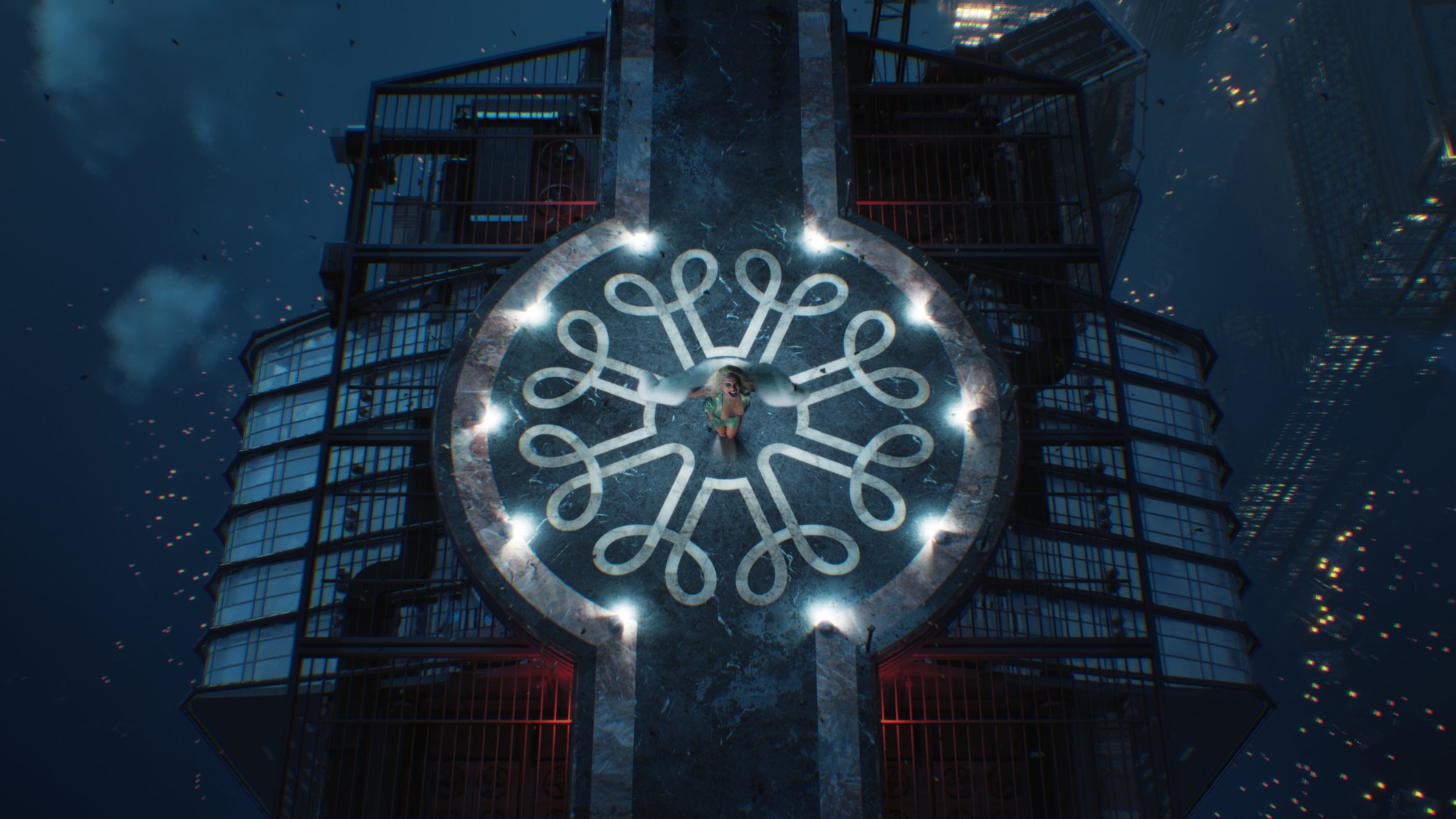 A woman standing on top of a circular city rooftop with a decorative pattern, surrounded by a high-rise building at night.