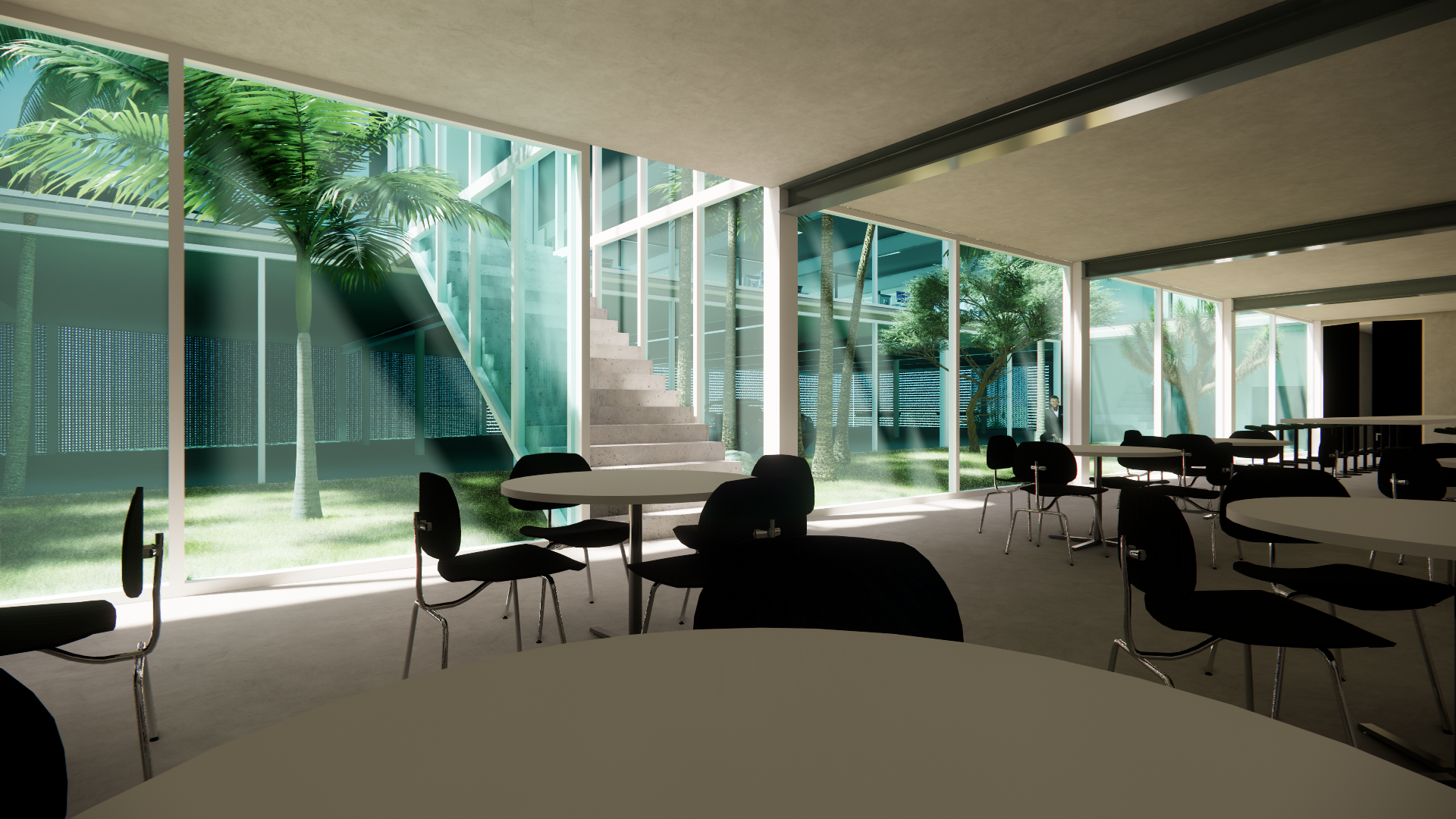Modern conference room with large windows and a view of trees outside. There are several round tables with black chairs, and a staircase visible through the windows.