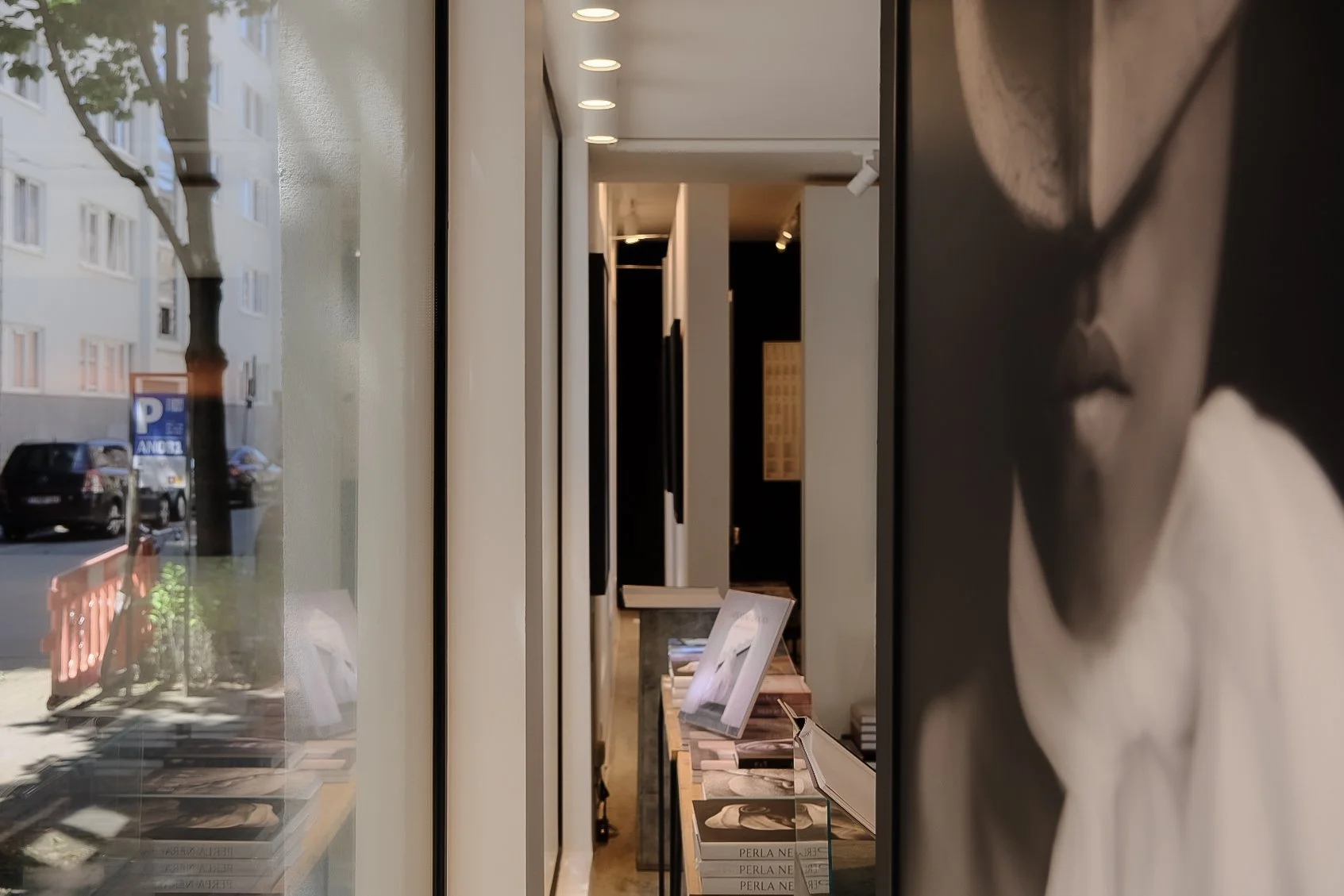 Interior view of a modern art gallery with bespoke lighting and custom design integration by Tom Naeyaert Architecture in Antwerp.